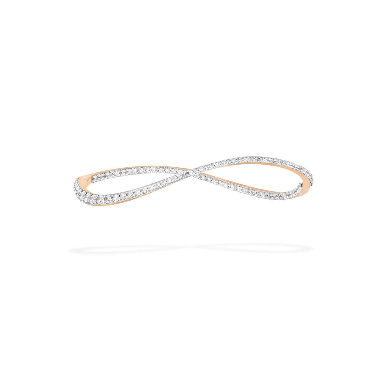 A transformable jewel : a bangle-hoop earring presented as an earring here. This piece is crafted in 18k rose gold and set with natural diamonds. Thanks to an ingenious patented mechanism, the jewel switch from a bangle to an earring.