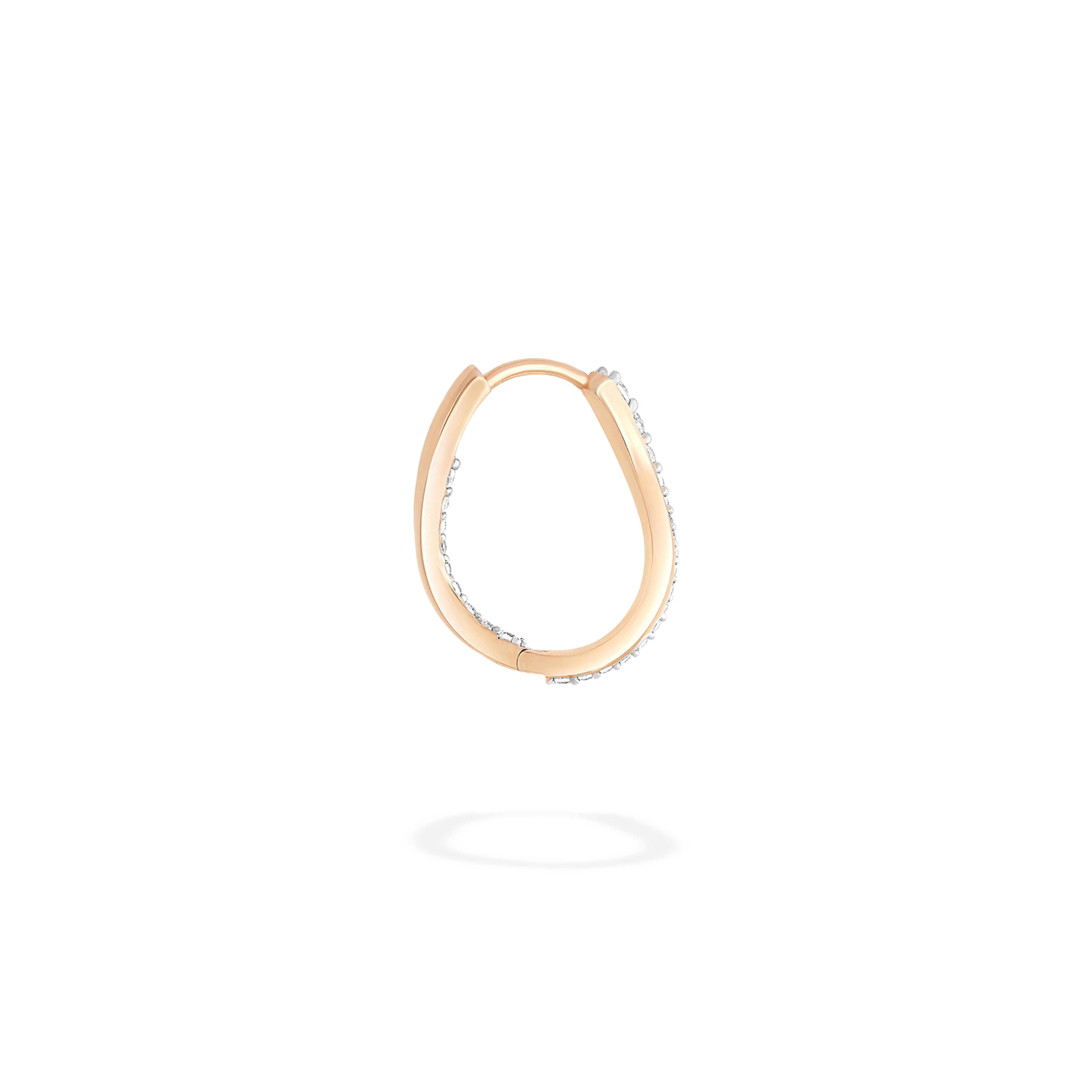 The hoop earring presented here in profile. This piece is crafted in 18k rose gold and set with natural diamonds. This jewel and its undulations are inspired by the Caustics, the luminous phemonem of light meeting water.