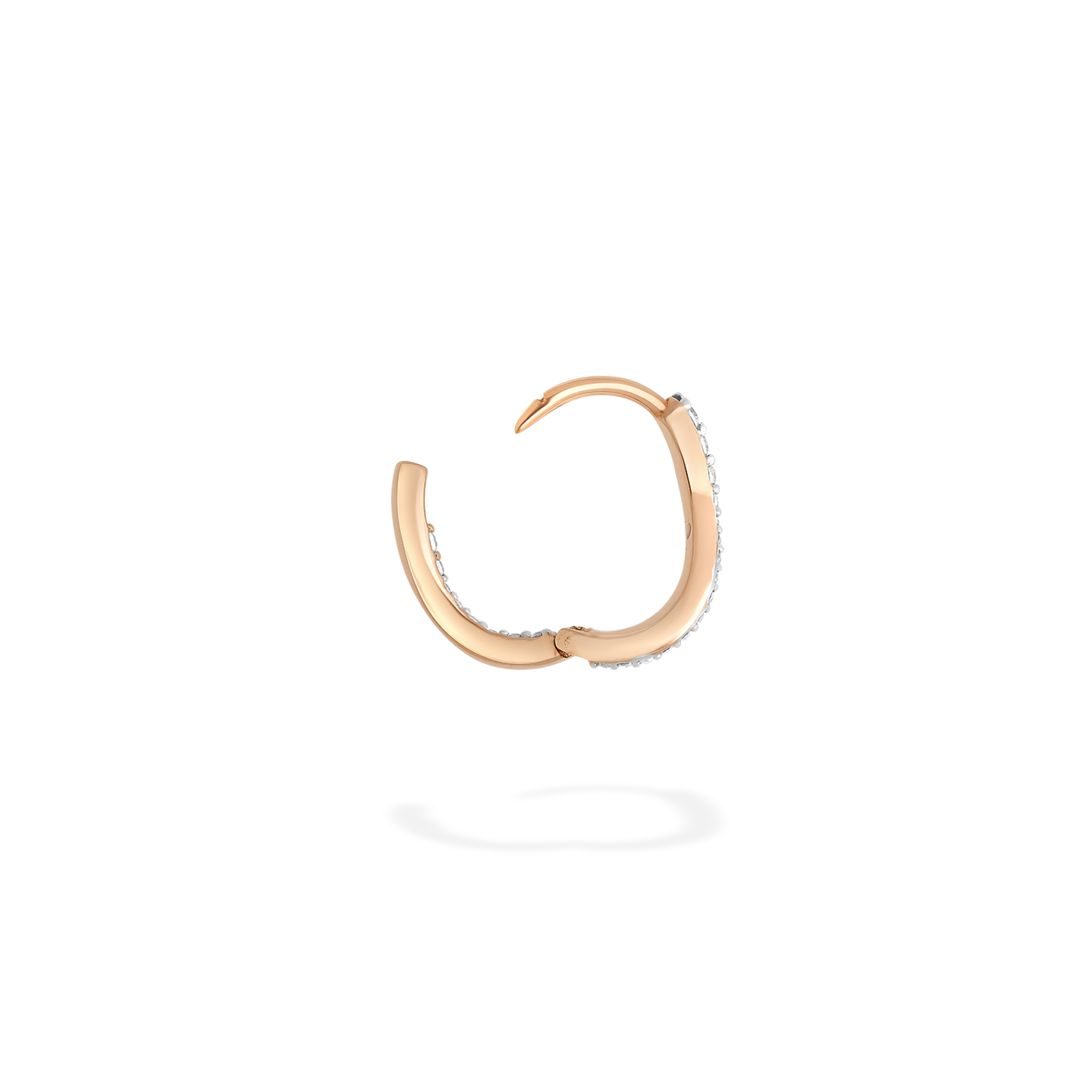 The petite hoop earring presented here in profile. This piece is crafted in 18k rose gold and set with natural diamonds. This jewel and its undulations are inspired by the Caustics, the luminous phemonem of light meeting water. It has an ingenious clip mechanism.