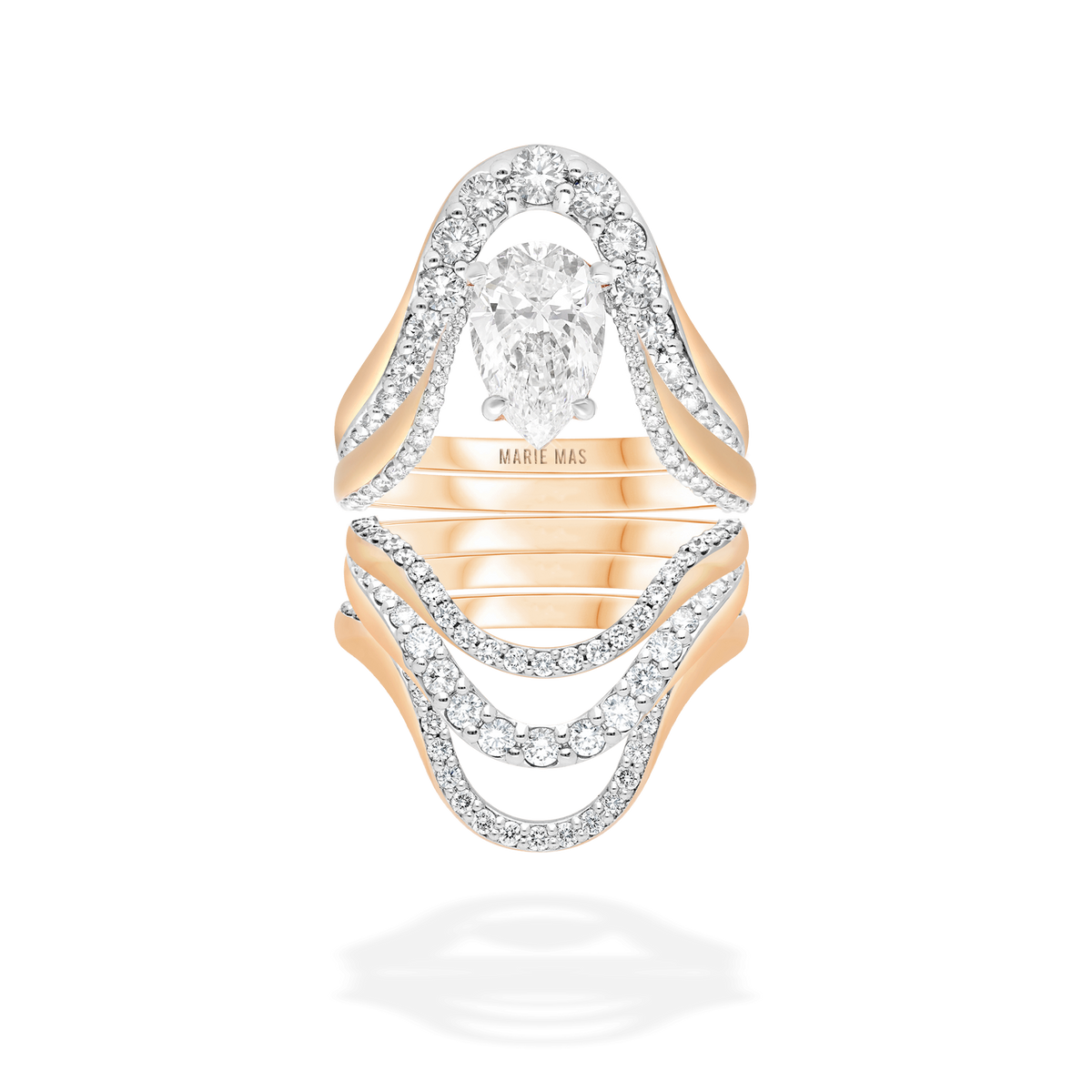Close-up of the MARIE MAS Sunita’s Ring Stack in 18k rose gold, composed of five rings: the Grand Aura Ring, Aura Ring with a pear-shaped diamond, Halo Ring, Grand Halo Ring and Aura Ring. The stack combines sculptural silhouettes with pavé-set diamonds and a central pear-shaped diamond for a refined, layered look.
