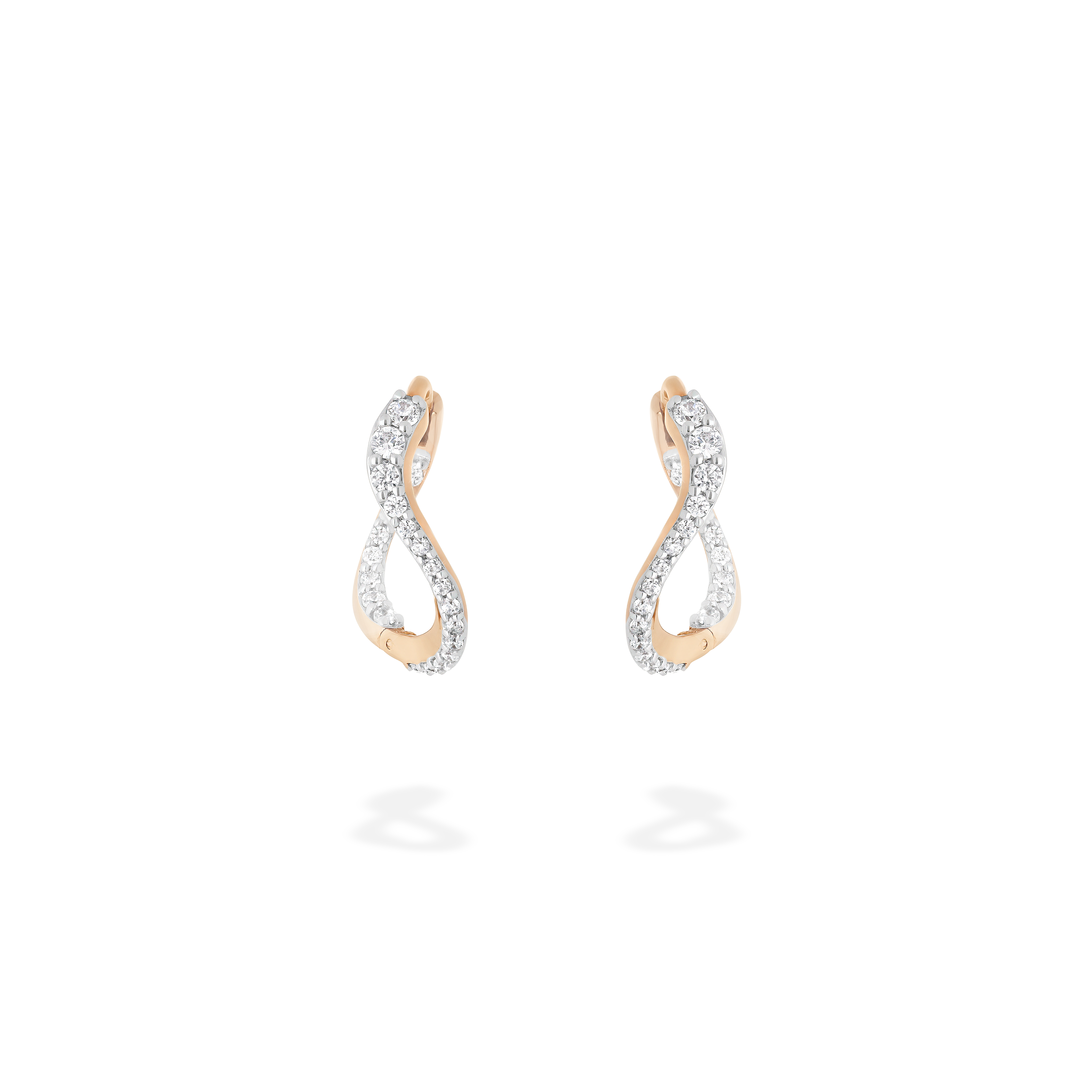 A pair of petite hoop earrings presented here from face. These pieces are crafted in 18k rose gold and set with natural diamonds. These jewels and their undulations are inspired by the Caustics, the luminous phemonem of light meeting water.