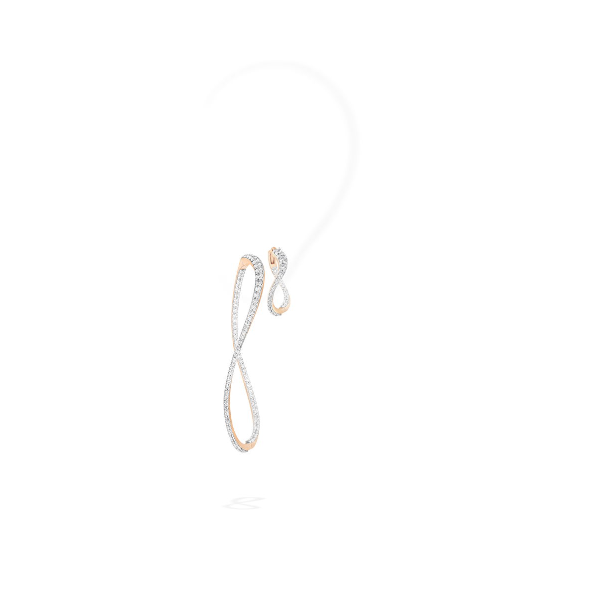 A set composed of a transformable bangle-hoop earring and a hoop earring. The fine jewelry pieces are crafted in 18k gold and set with natural diamonds.