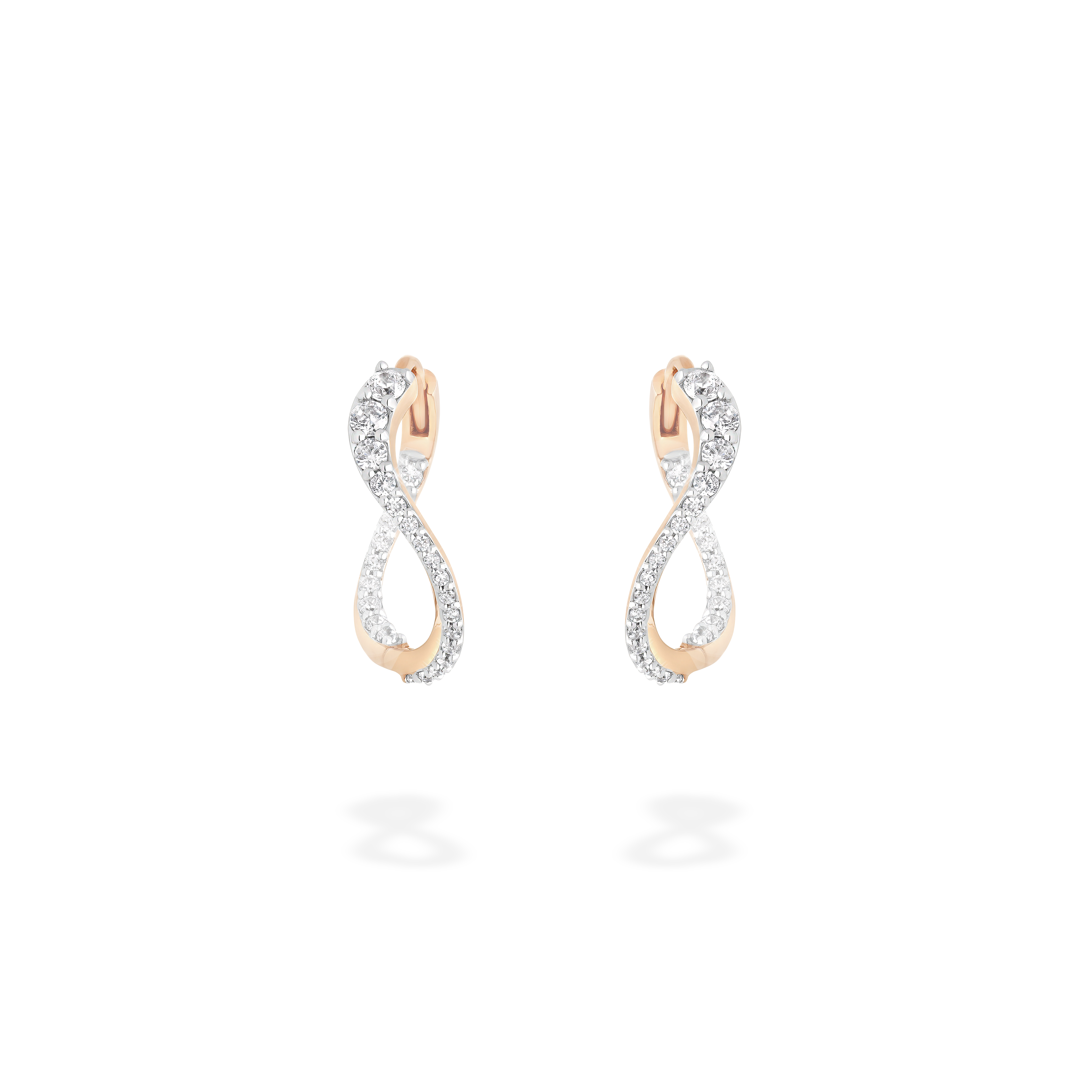A pair of undulating hoop earrings presented here from face. This piece is crafted in 18k rose gold and set with natural diamonds. This jewel and its undulations are inspired by the Caustics, the luminous phemonem of light meeting water.