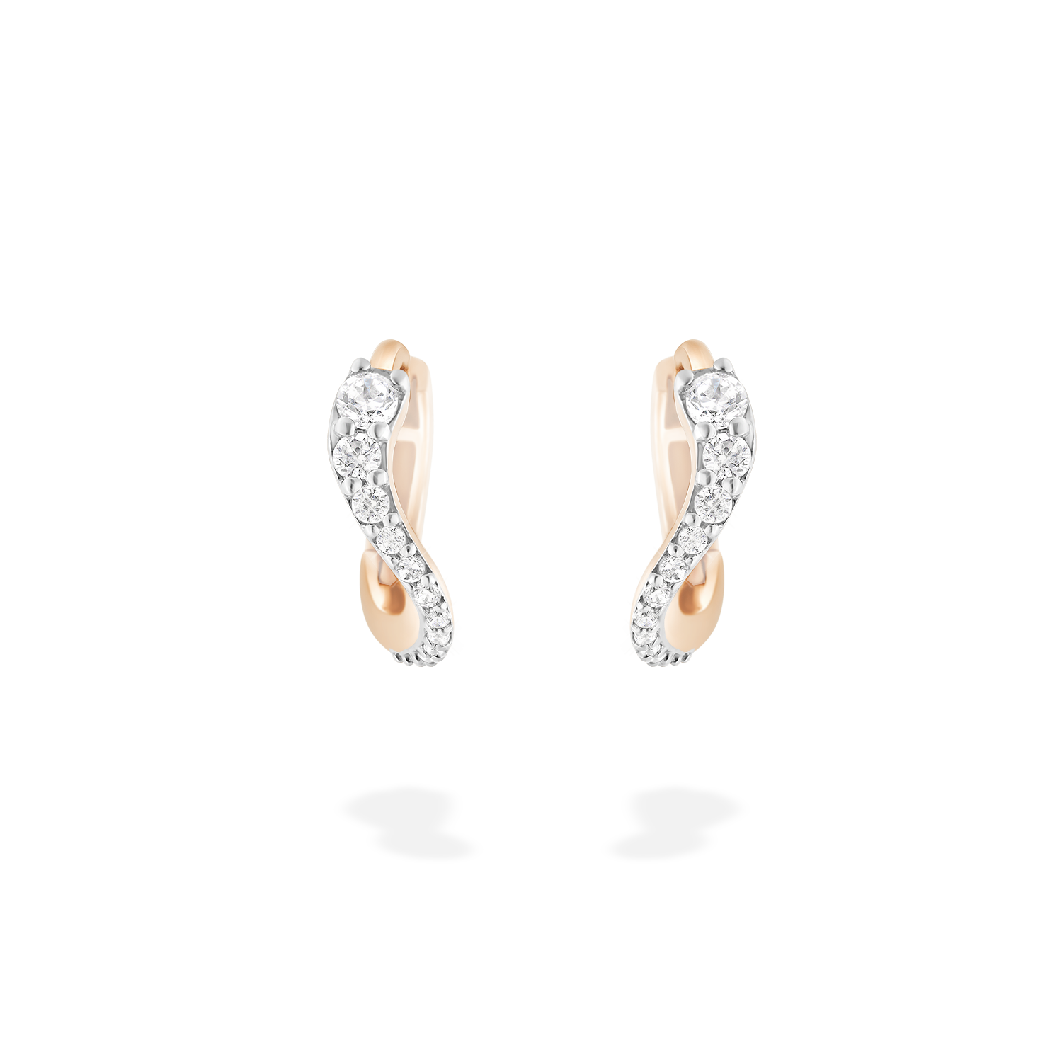 A pair of mini hoop earrings presented here from face. These pieces is crafted in 18k rose gold and set with natural diamonds. These jewels and its undulations are inspired by the Caustics, the luminous phemonem of light meeting water.