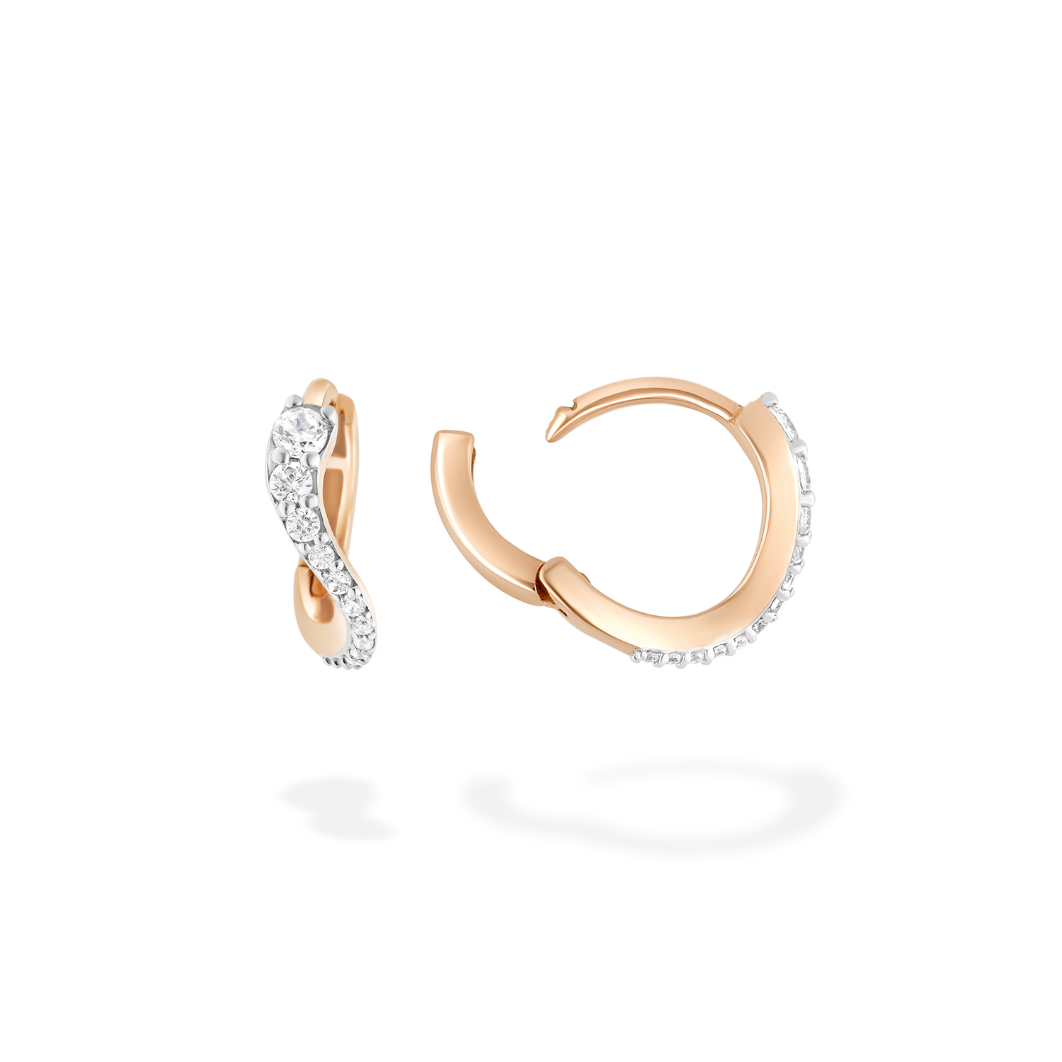 A pair of mini hoop earrings presented here from face and in profile. These pieces is crafted in 18k rose gold and set with natural diamonds. These jewels and its undulations are inspired by the Caustics, the luminous phemonem of light meeting water.
