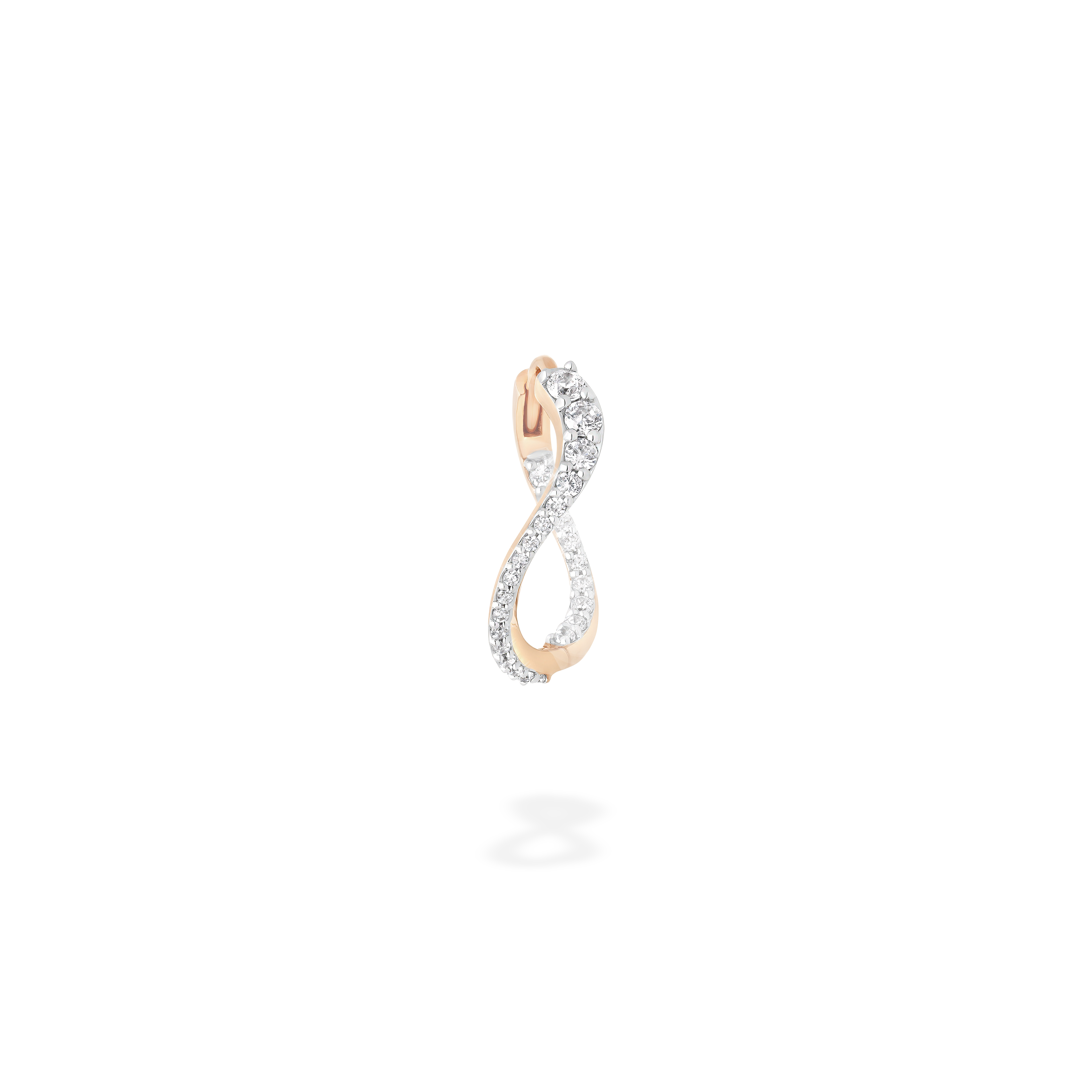 The hoop earring presented here from face. This piece is crafted in 18k rose gold and set with natural diamonds. This jewel and its undulations are inspired by the Caustics, the luminous phemonem of light meeting water.