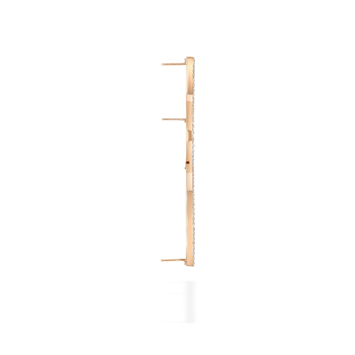 A transformable jewel brooch-earring featuring an ingenious mechanism that allows the posts to retract or extend, ensuring a secure and comfortable wear whether styled on the ear or as a brooch. This fine jewelry piece is crafted in 18k gold and set with natural diamonds. Its curves evoke caustic light, where water and light meet.