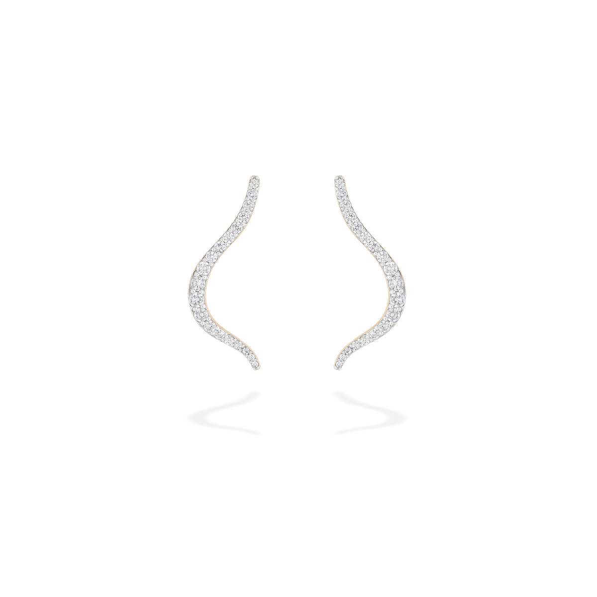 A pair of transformable jewel brooch-earring featuring an ingenious mechanism that allows the pins to retract or extend, ensuring a secure and comfortable wear whether styled on the ear or as a brooch. These fine jewelry pieces are crafted in 18k gold and set with natural diamonds. Its curves evoke caustic light, where water and light meet.