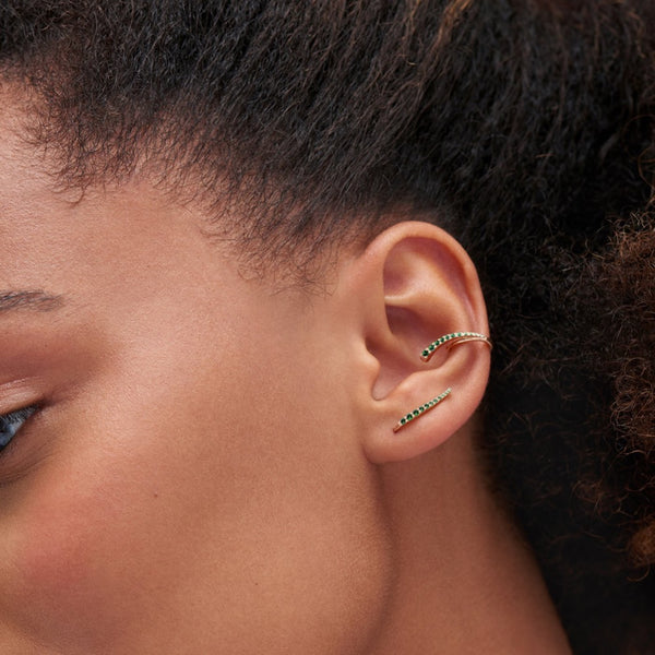 Serena wearing emerald ear cuff and ear jewel